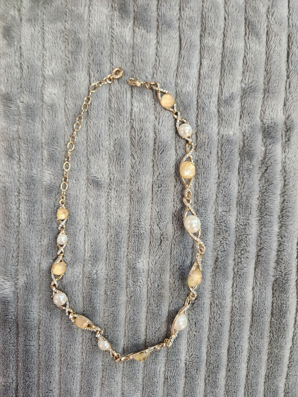 Anne Klein gold-filled caged pearl necklace measures approximately 15.5